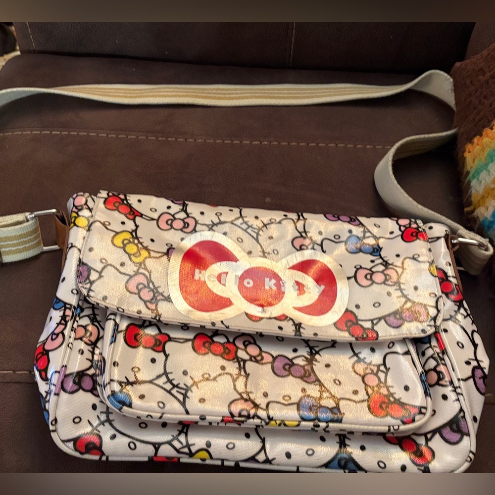 Sanrio Hello Kitty multi color on white crossbody bag with front flap & more